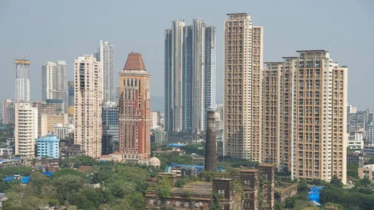 Aerial view of Mumbai skyline representing real estate growth and cranes